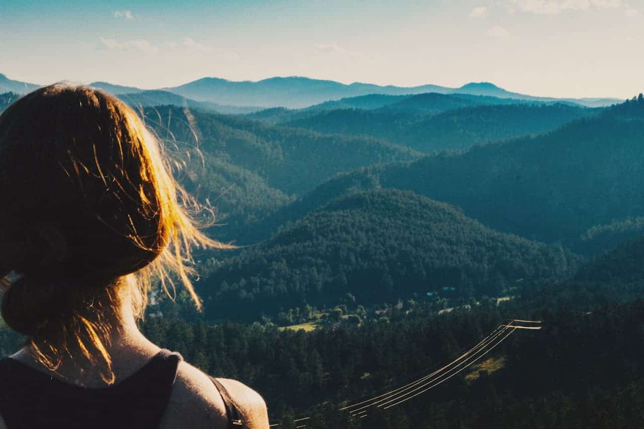 A woman looking out over the hills of south dakota t20 wkjggw (1)